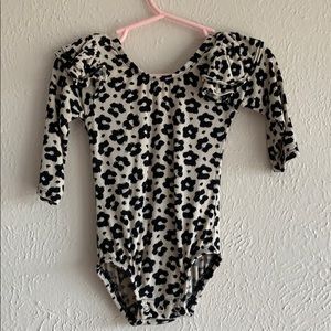 This tribe of three ruffle sleeve leotard